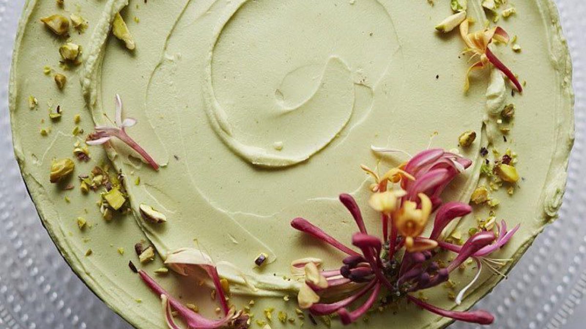 Pistachio cake with edible flowers